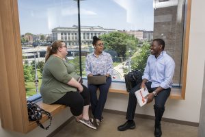 Three students at the RLB Library
